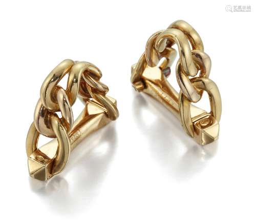 A pair of cufflinks by Cartier, of chain link hinged stirrup design, signed Cartier and numbered