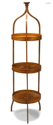 An Edwardian satinwood and ebony strung three-tier cake stand, with turned finial above three
