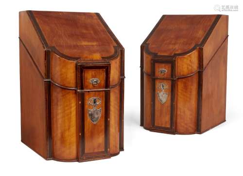 A pair of George III satinwood slope and serpentine front knife boxes, the silver handles and