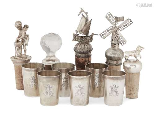 Two Dutch .833 silver bottle stops and a set of six German silver liqueur cups, one bottle stop