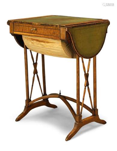 A Regency satinwood and crossbanded drop-leaf games/work table, the reversible top with green