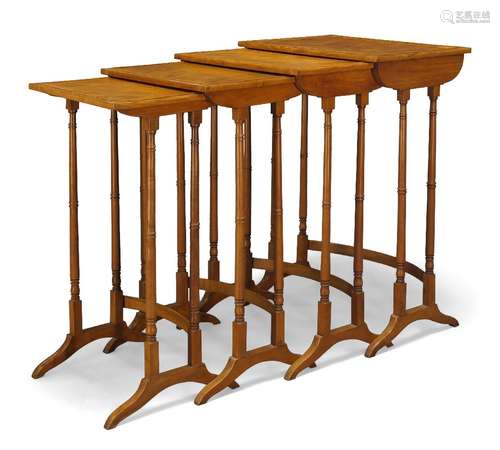 An Edwardian satinwood quartetto nest of tables, the rectangular cockbeaded tops on ring turned