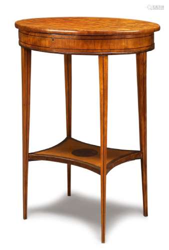 A George III satinwood and line inlaid occasional table, with swivel top enclosing an adjustable