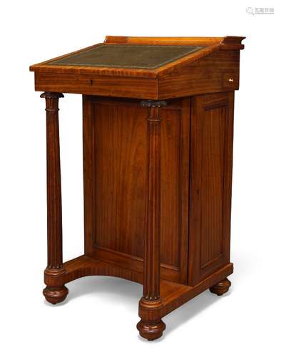 An early Victorian satinwood Davenport by Miles & Edwards, the green leather inset slope enclosing