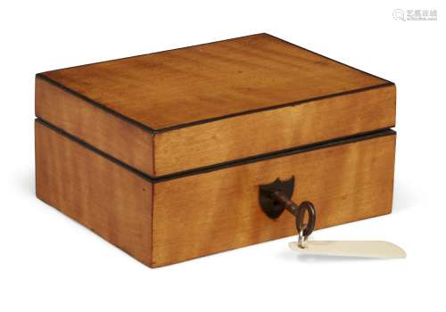 A satinwood sewing necessaire, 19th century, with ebony edging fitted interior with ivory thimble,