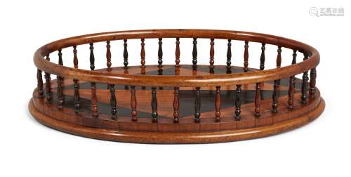 A Regency calamander and satinwood inlaid oval spindle galleried tray, the central panel inlaid with
