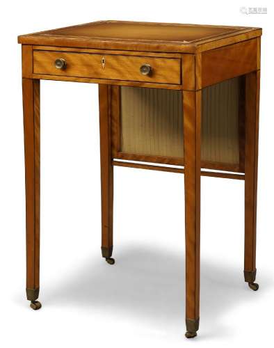 A late Victorian satinwood ladies writing table, with hinged lectern top inset with tan leather