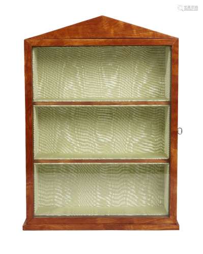 A George III satinwood wall display cabinet, with pointed arch pediment above a glass panel door