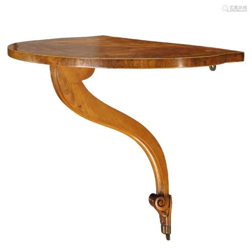 A George III style crossbanded satinwood wall bracket, 19th century and later, the shaped top on