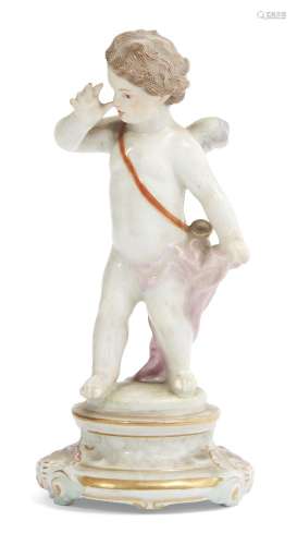 A 19th Century Meissen cupid winged figure, on stepped base, bears marks to base, 13.5cm high.Please