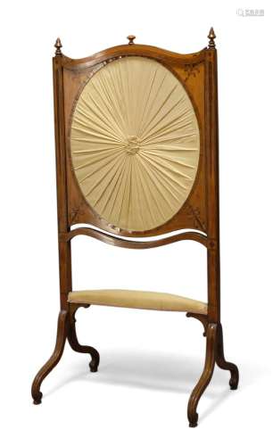 A satinwood and inlaid firescreen, 19th Century, the twin finial top of serpentine outline, with