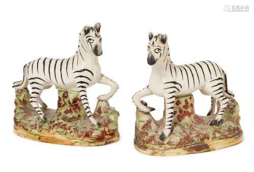 A pair of Victorian Staffordshire flatback zebras, 19th century, 12cm high, (2). Provenance: