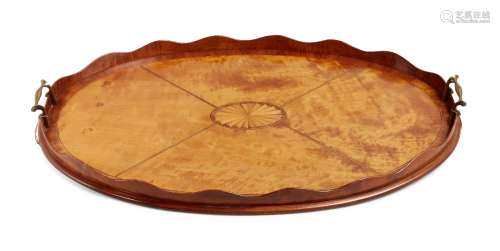 A George III satinwood oval tray, wavy gallery, with central inlaid batwing oval and twin brass