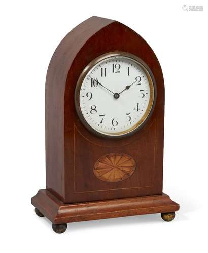 An Edwardian satinwood mantel clock, French timepiece movement, in a lancet-shape case, on bun brass