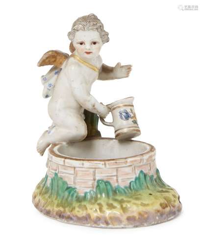 A Berlin KPM porcelain Cupid, 19th century, kneeling upon the edge of a well, interior of well