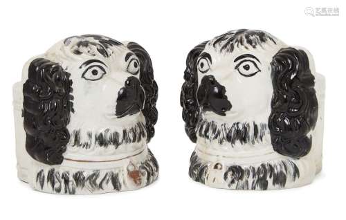 A pair of 19th Century Staffordshire black and white King Charles spaniel head furniture rests, 12cm