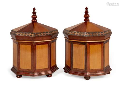 A pair of George III rosewood and satinwood octagonal boxes, baluster turned finial above domed