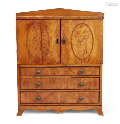 A George III satinwood miniature linen press, a pair of doors with inlaid decoration, enclosing
