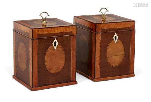 A pair of George III mahogany cube-shape tea caddies, with satinwood crossbanding and boxwood and