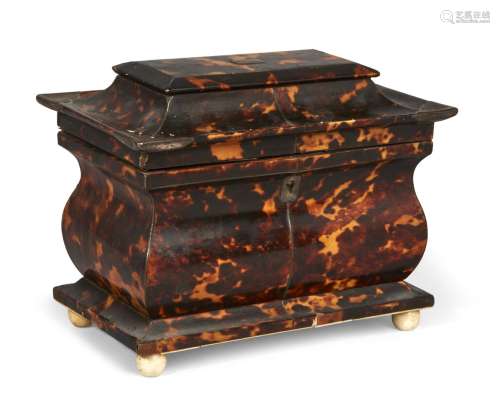 A George IV tortoiseshell sarcophagus shaped two-division tea caddy, with silver inlay, the lidded