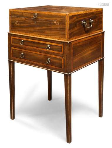 A George III mahogany and satinwood crossbanded gentleman’s portable toilet box, the hinged top