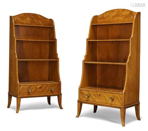 A pair of Regency satinwood waterfall bookcases, with four graduated shelves above single drawer