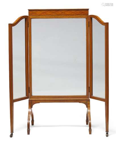 An Edwardian satinwood, ebony strung and glazed three-fold firescreen, the rectangular central panel