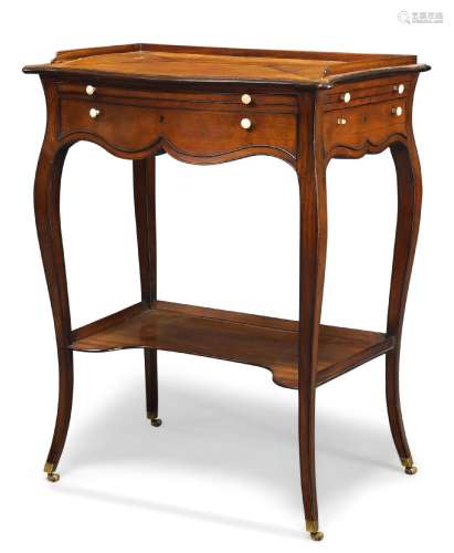 A George III satinwood and crossbanded serpentine writing table, to a design by Thomas