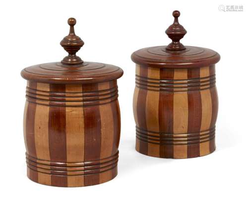 A pair of satinwood banded tobacco jars, 19th century, of stave construction, the lids with baluster