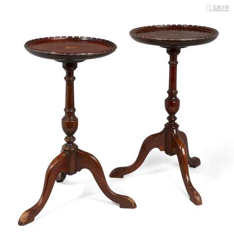 A pair of Edwardian mahogany and satinwood inlaid dish-top tripod wine tables, the top inlaid with