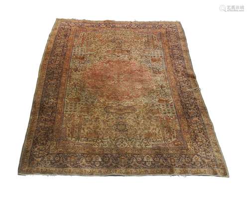 A Tabriz rug, early to mid 20th Century, the brick red medallion in an ivory field, decorated with