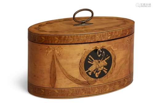 A George III satinwood oval inlaid two-division tea caddy, inlaid with musical trophies flanked by