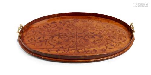 A George III satinwood oval inlaid tea tray, decorated overall with scrolling foliage, with brass