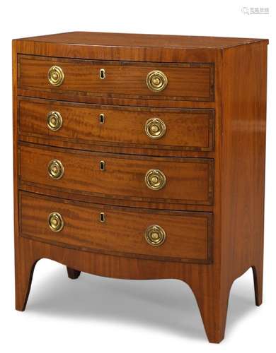 A small Regency satinwood and crossbanded bow-fronted chest, with four long graduated drawers, on