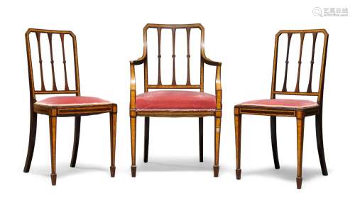 An Edwardian mahogany and satinwood salon armchair, with slatted back over pink overstuffed seat, on