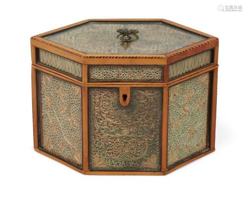 A George III paperscroll hexagonal tea caddy, with satinwood frame and glazed panels, dated paper