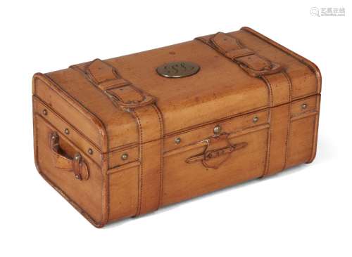 An unusual satinwood jewel casket, mid-19th century, in the form of a carved “leather” trunk,