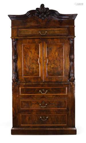 A French walnut secretaire, early 20th century, the moulded cornice centred by scrolling decoration,