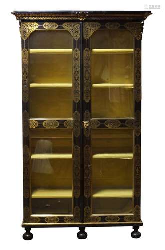 A Napoleon III ebonised and brass inlaid vitrine cabinet, with overall inlaid scrollwork panels,