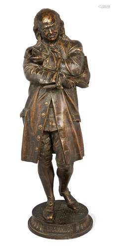 An American gilt spelter figure of Benjamin Franklin, early 20th century, modelled standing with