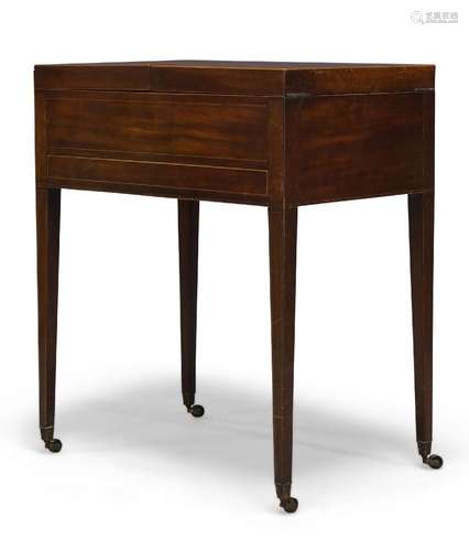 A George III mahogany and line inlaid dressing table, the top opening to reveal fitted interior with