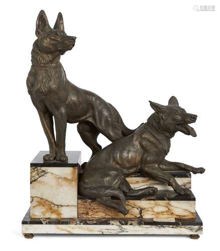 After Louis Albert Carvin, French, 1870-1935, two spelter Alsatians on a stepped two-colour marble