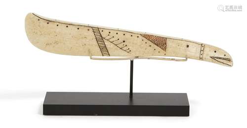 An Inuit carved marine ivory snow knife, late 19th/early 20th century, in the form of an elongated