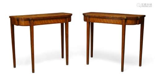 A pair of George III satinwood and tulipwood crossbanded side tables, the D-shaped top above