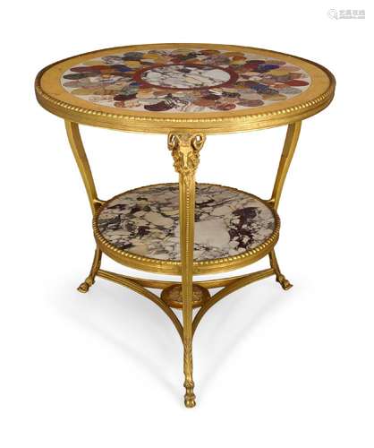 A gilt metal and specimen marble top two tier centre table, 20th century, the circular specimen