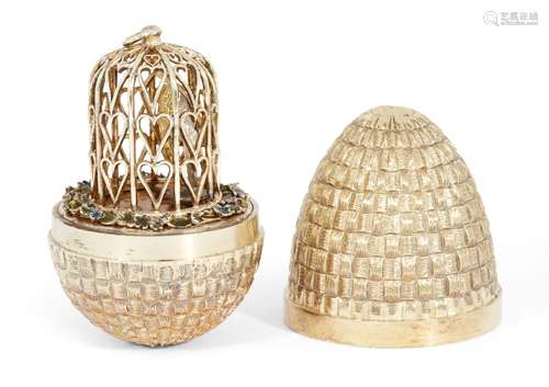 A silver gilt surprise egg by Stuart Devlin, London, c.1981, opening to reveal a pair of lovebirds