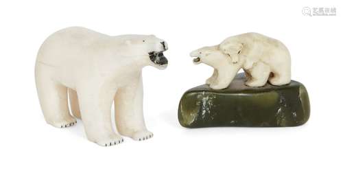 Two Inuit marine ivory carvings, early 20th century, one carved as a polar bear standing four