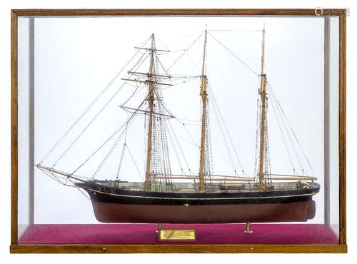 A wood model of a three masted topsail schooner, ‘Lizzie’, 20th century, with accompanying brass