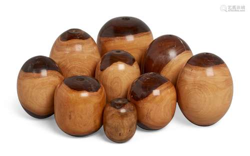 A group of nine turned lignum vitae weights, 20th Century, possibly pulley weights, of rounded ovoid