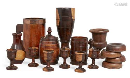 A group of lignum vitae and treen table objects, 18th and 19th Century, to include a lignum vitae